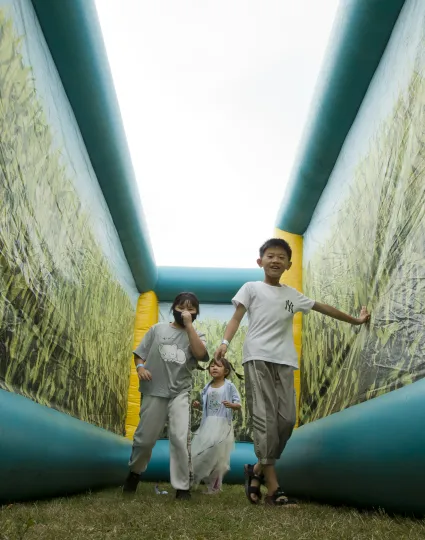 Children playing in inflatable maze.