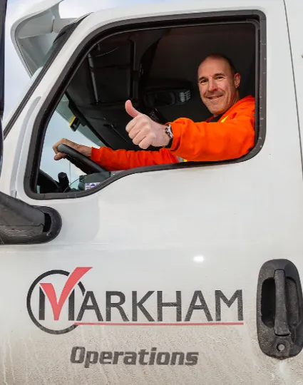 Operations staff gives the thumbs up from a truck 