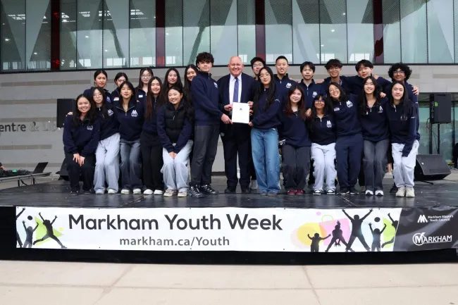 Mayor Frank Scarpitti on stage with members of Youth Council.