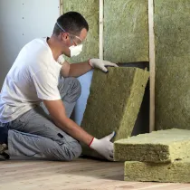 Person installing insulation