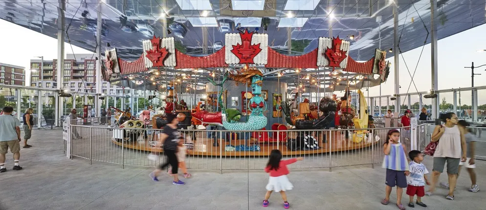 People playing on the Pride of Canada Carousel.