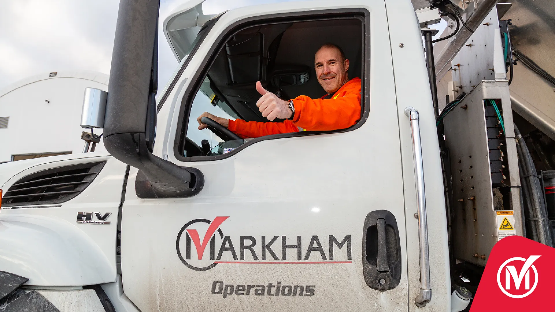 Operations staff gives the thumbs up from a truck 
