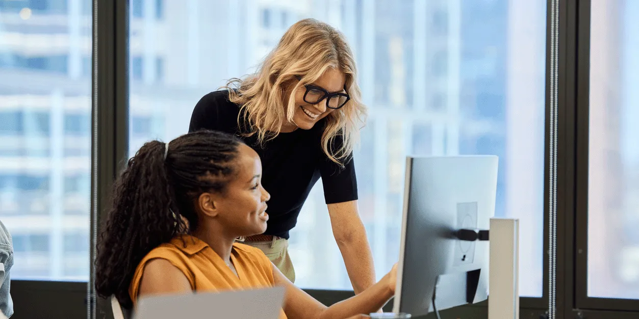 Two people working together in office.