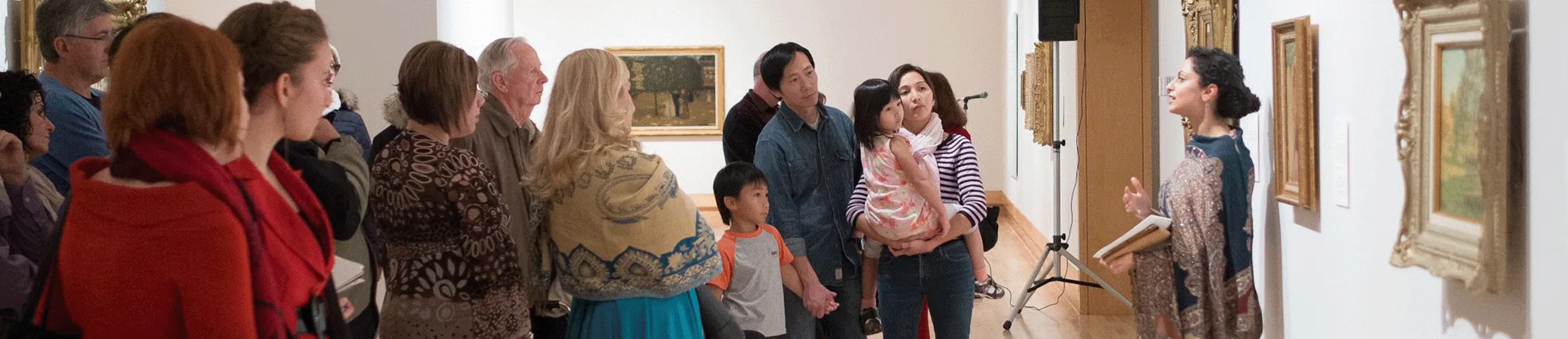 Group tour viewing art at an art gallary.